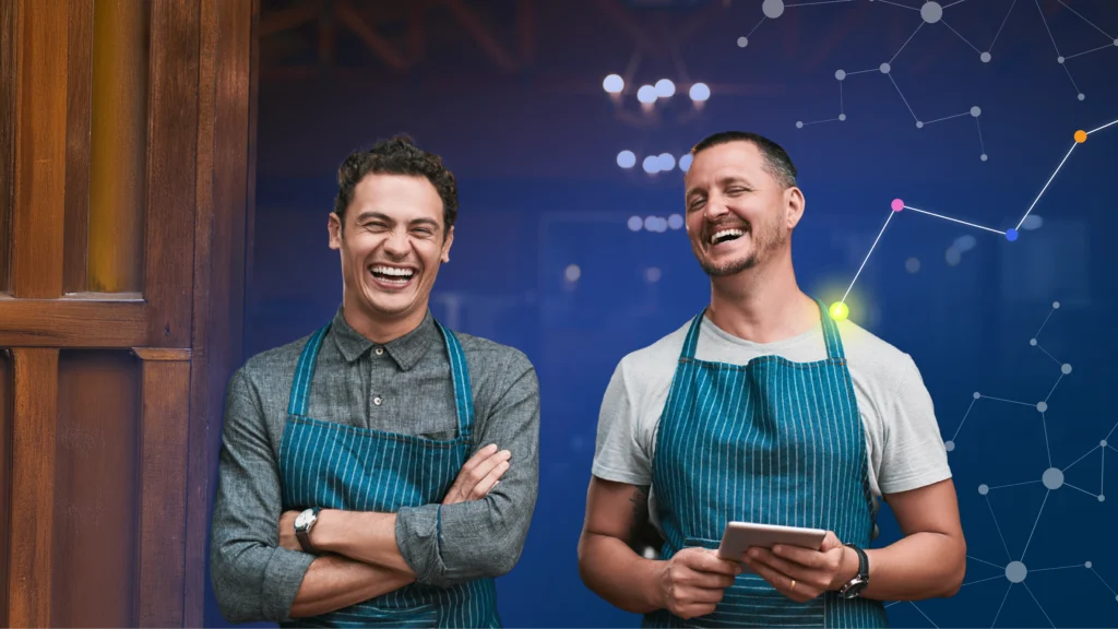 Two hospitality employees standing together